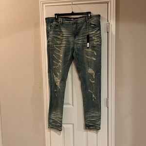 Nova Men’s Vintage blue jeans. Highly distressed (front only) 42x32.